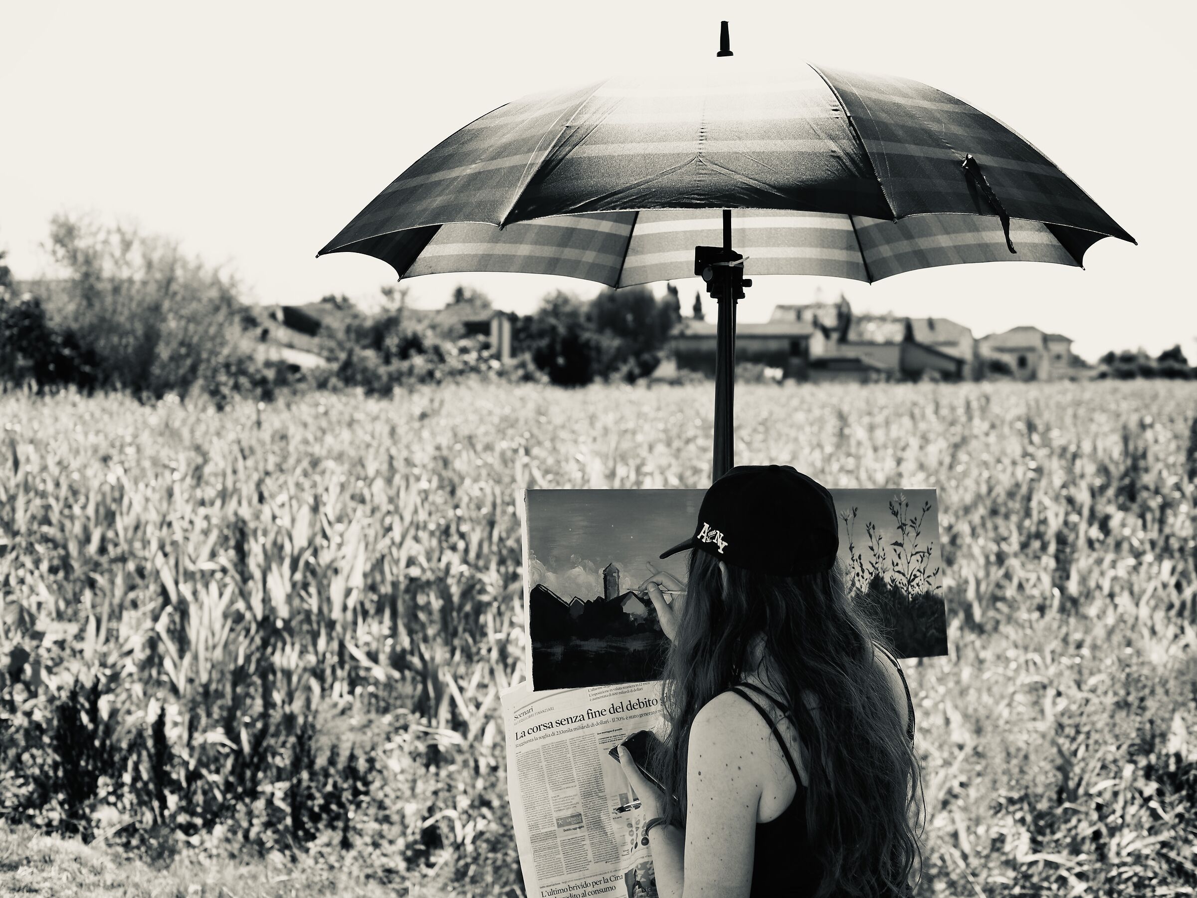 Landscaper with umbrella...