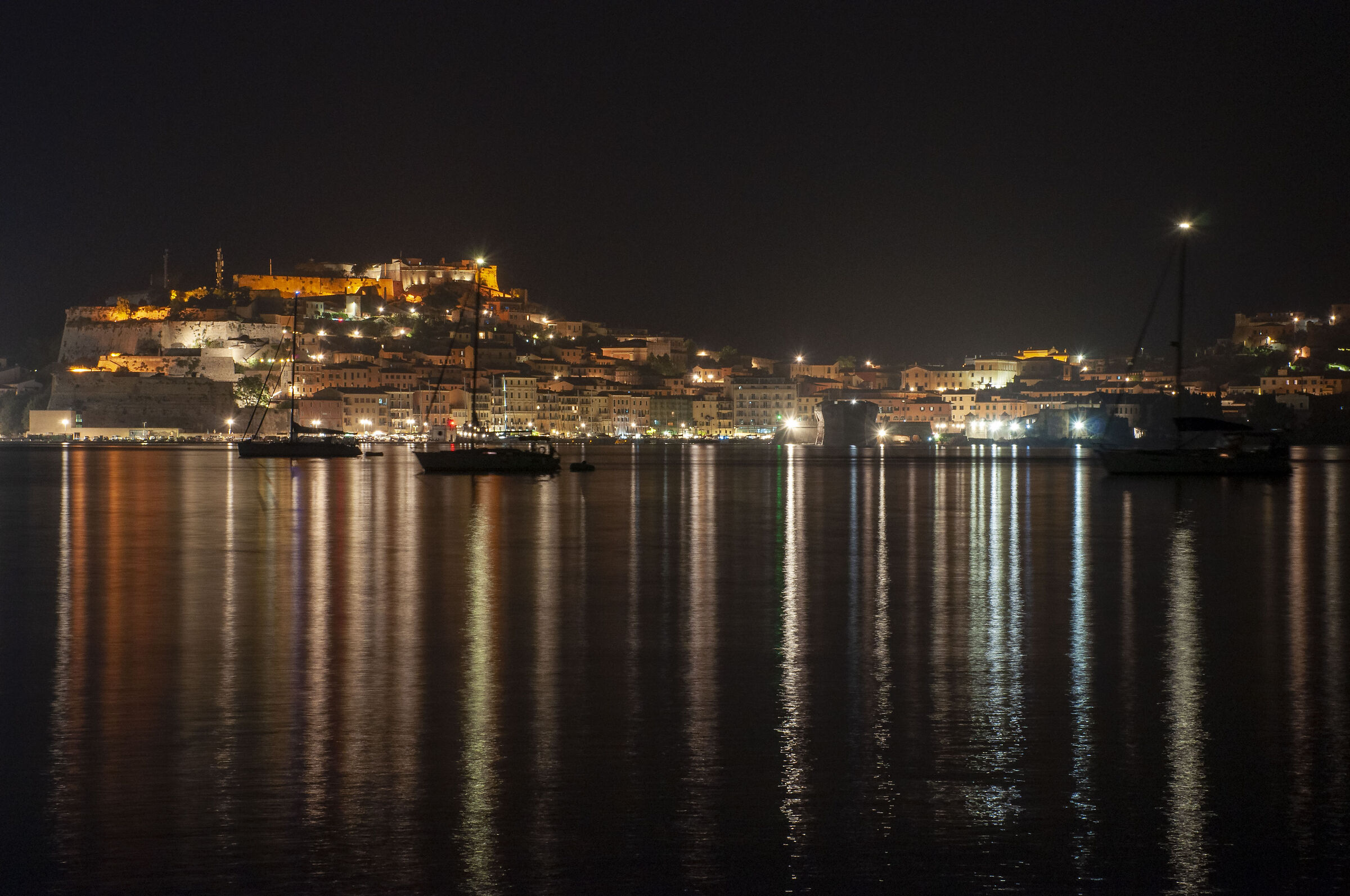 Portoferraio by night with calm sea...