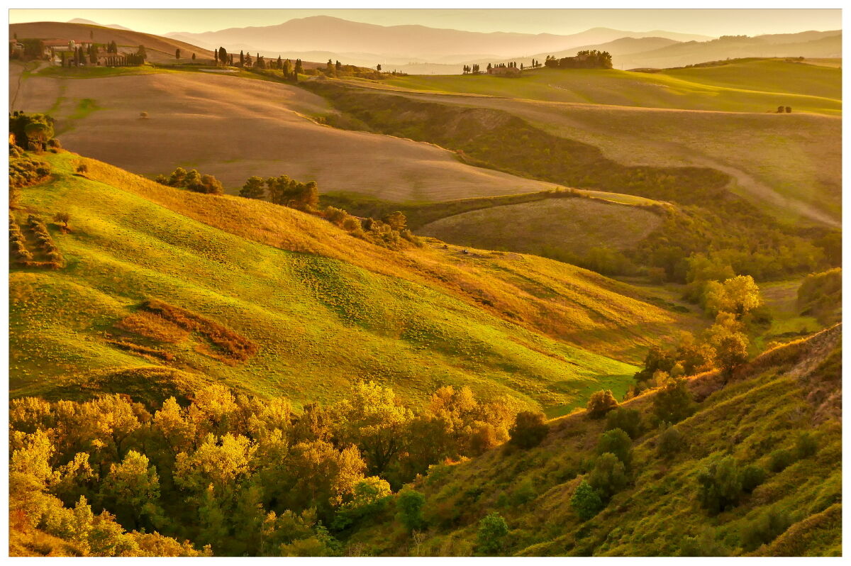 The light of the sunset on the rolling hills of Volterra_1...