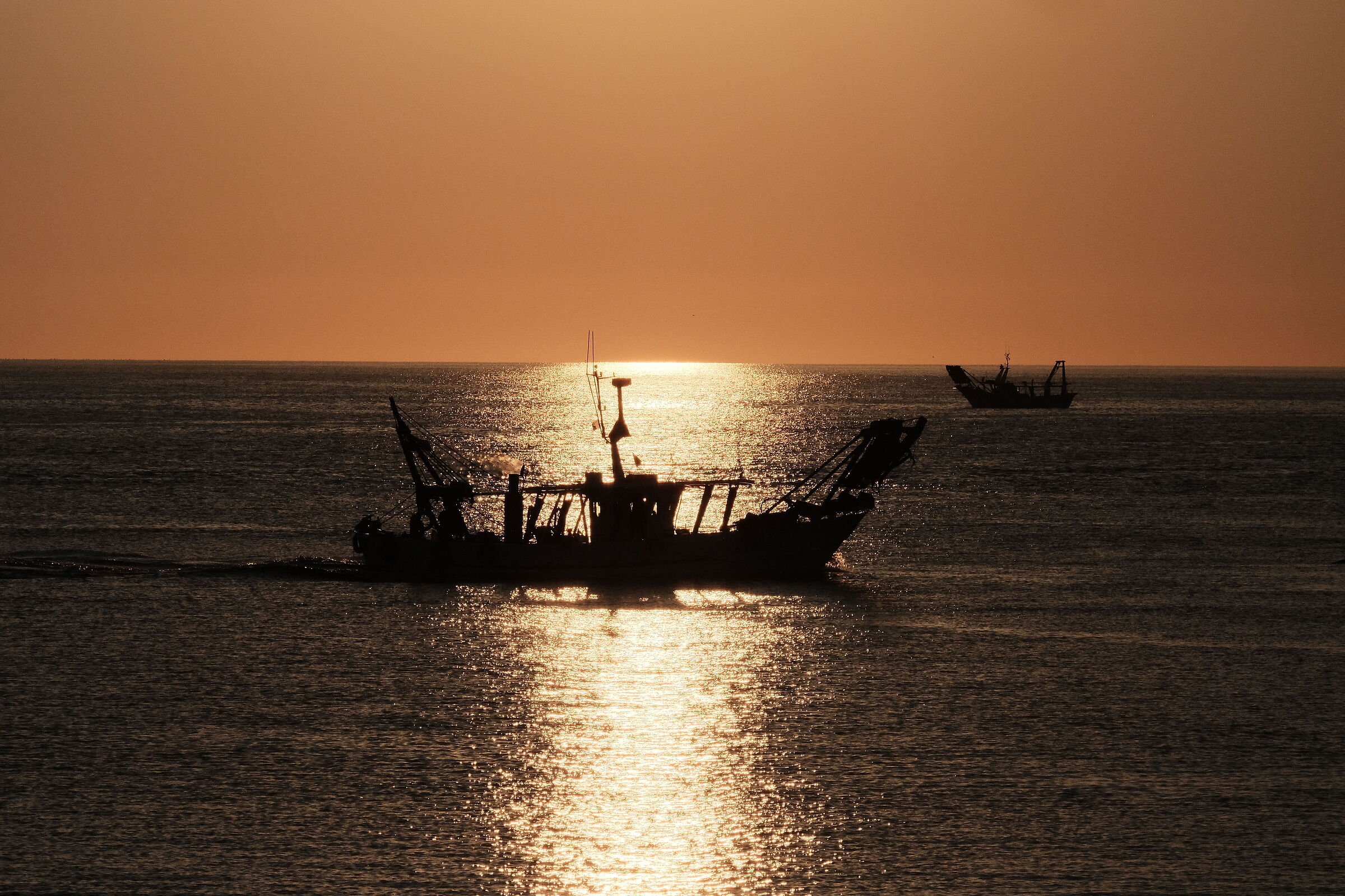 Fishing boat at dawn 2...