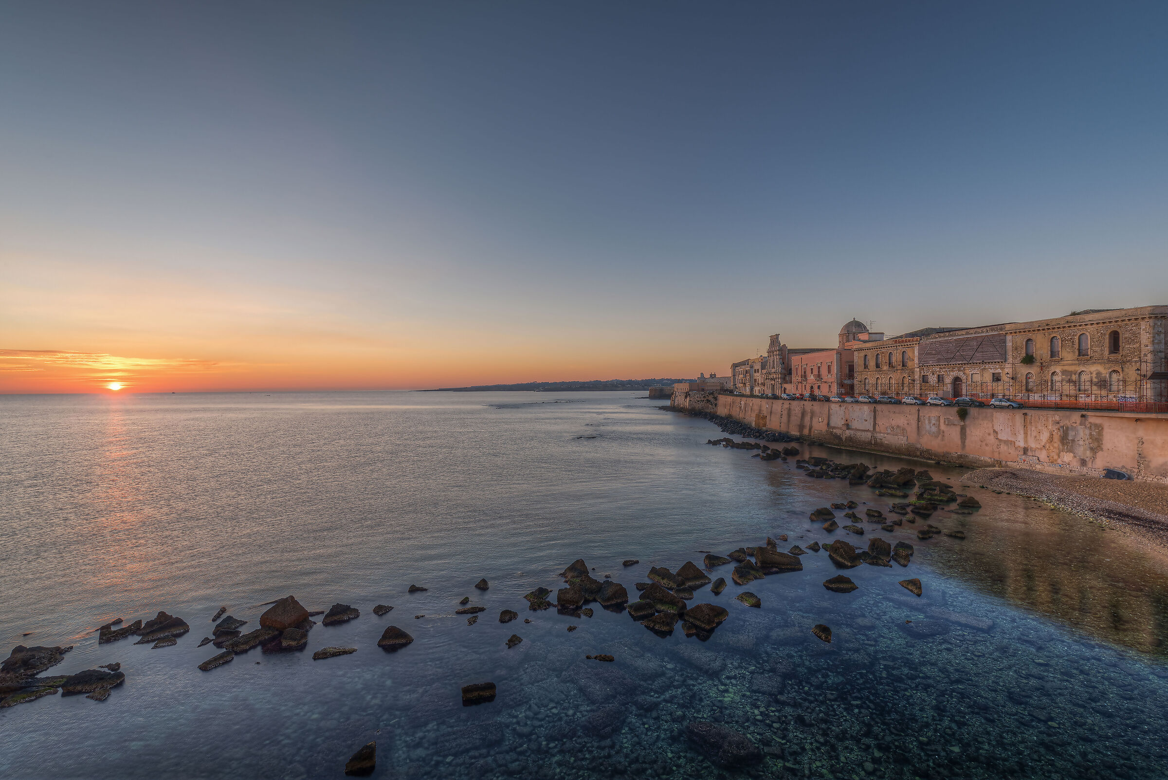 Sunrise on the seafront of Ortigia...