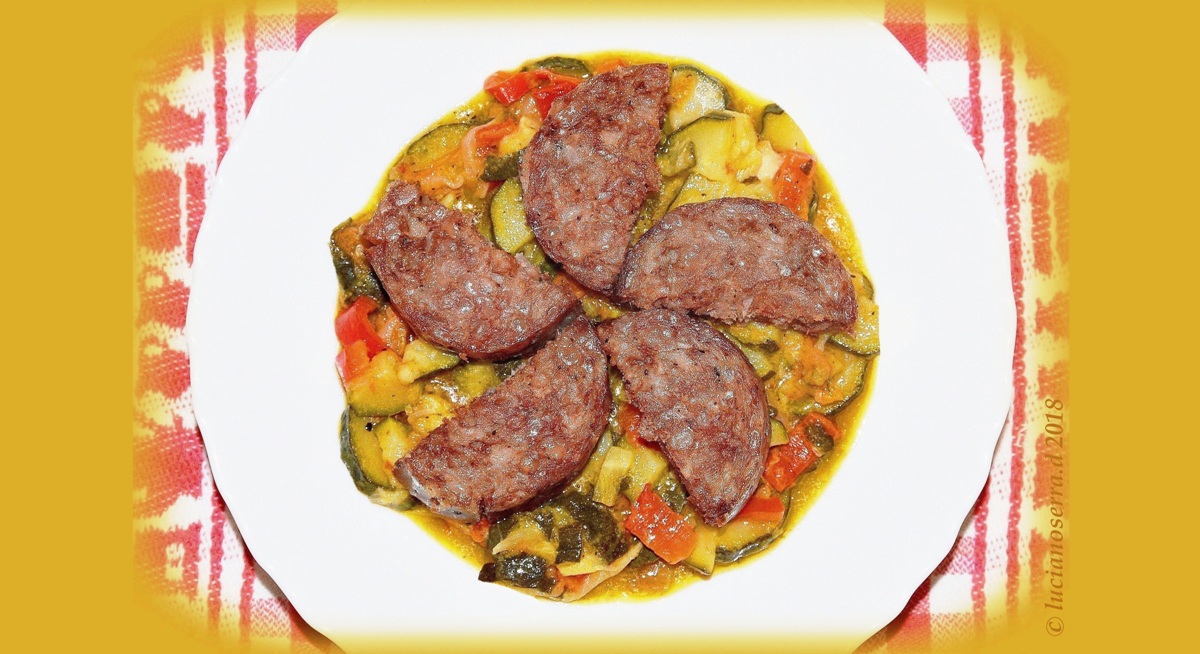 Cotechino on a bed of cooked vegetables...