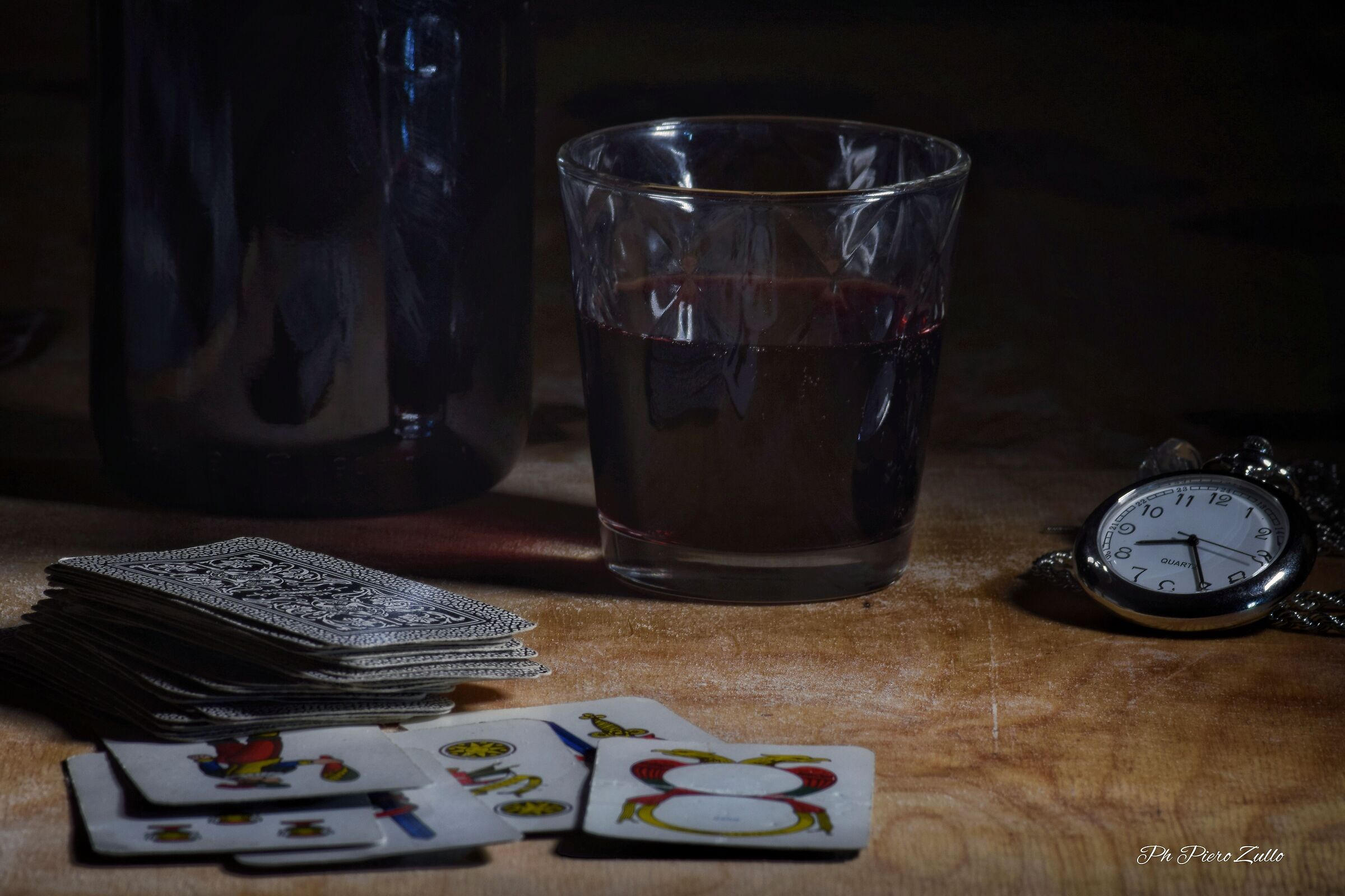 a glass of wine and a game of cards...