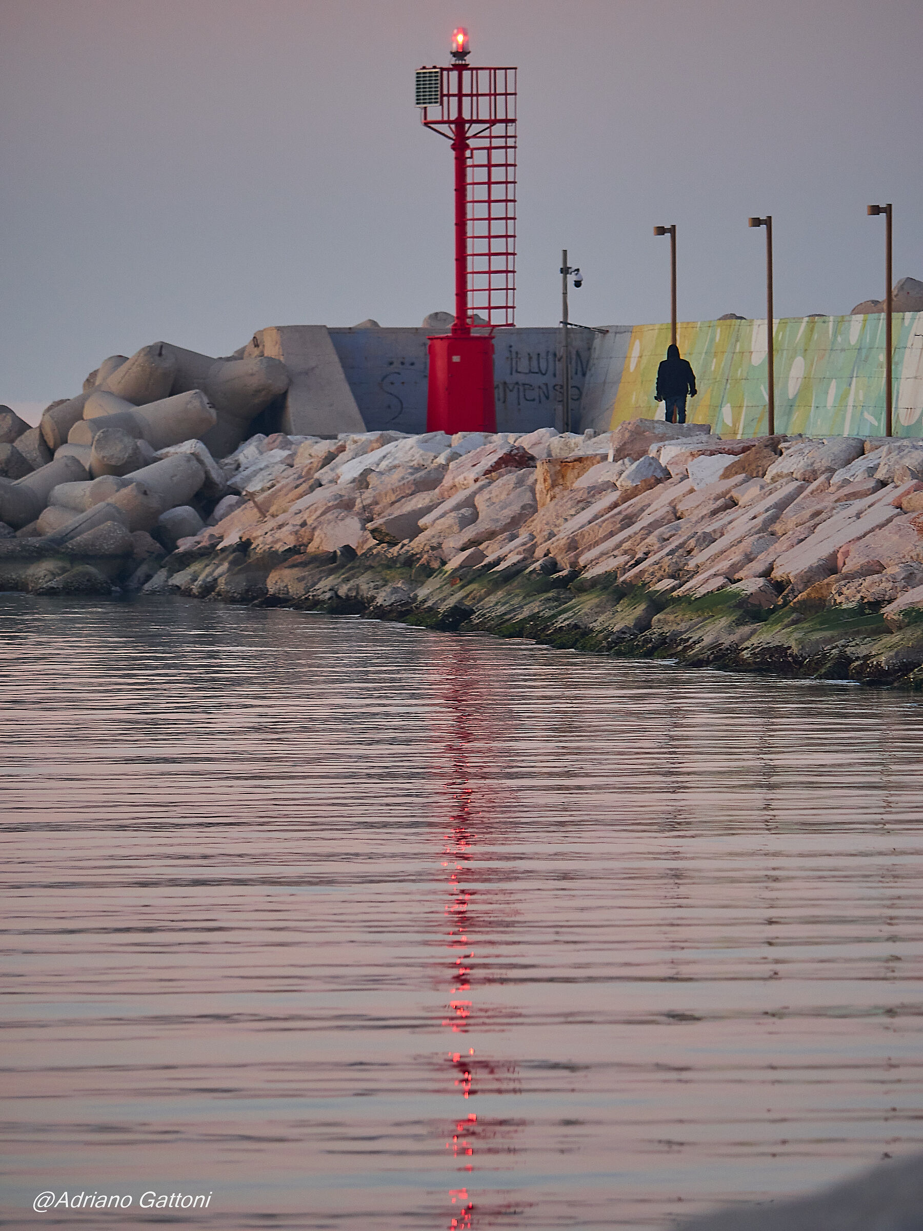 First light of the evening at the port of Pesaro...