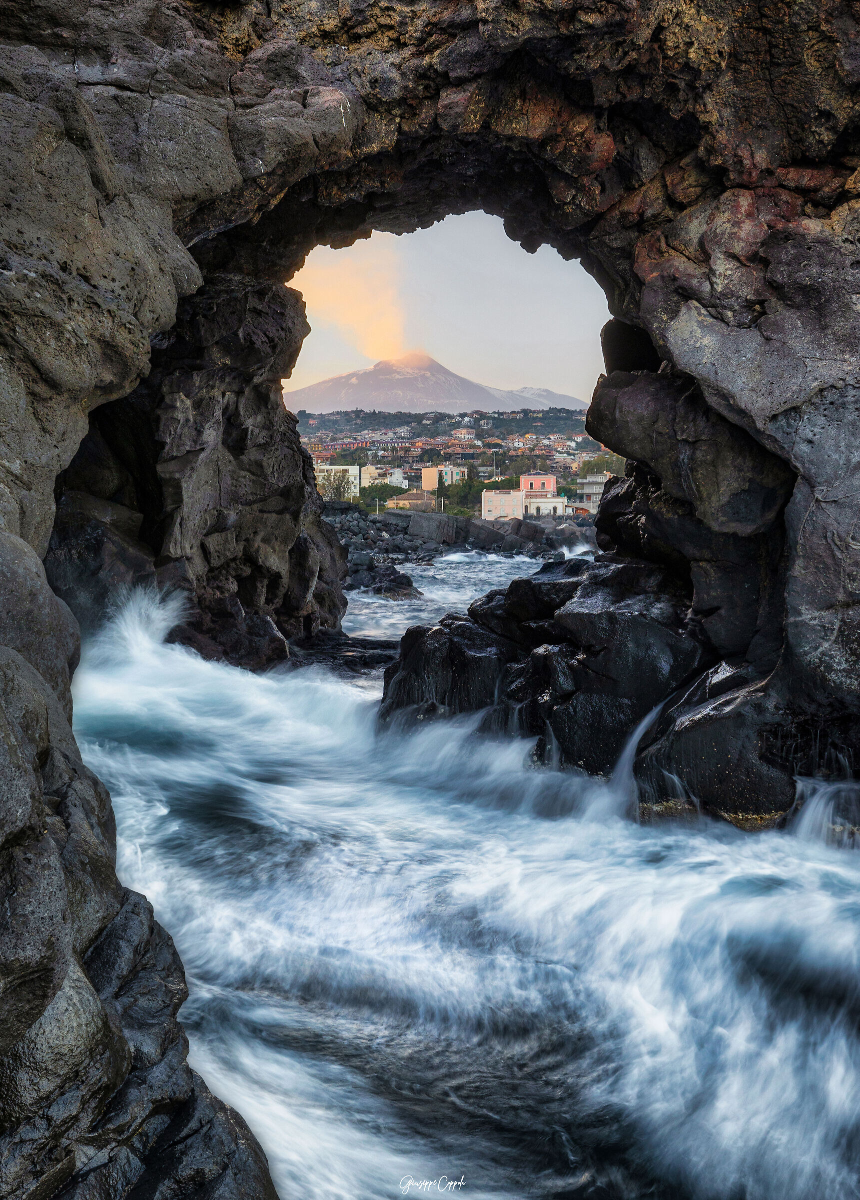 Window overlooking Etna from the cliff of Catania......