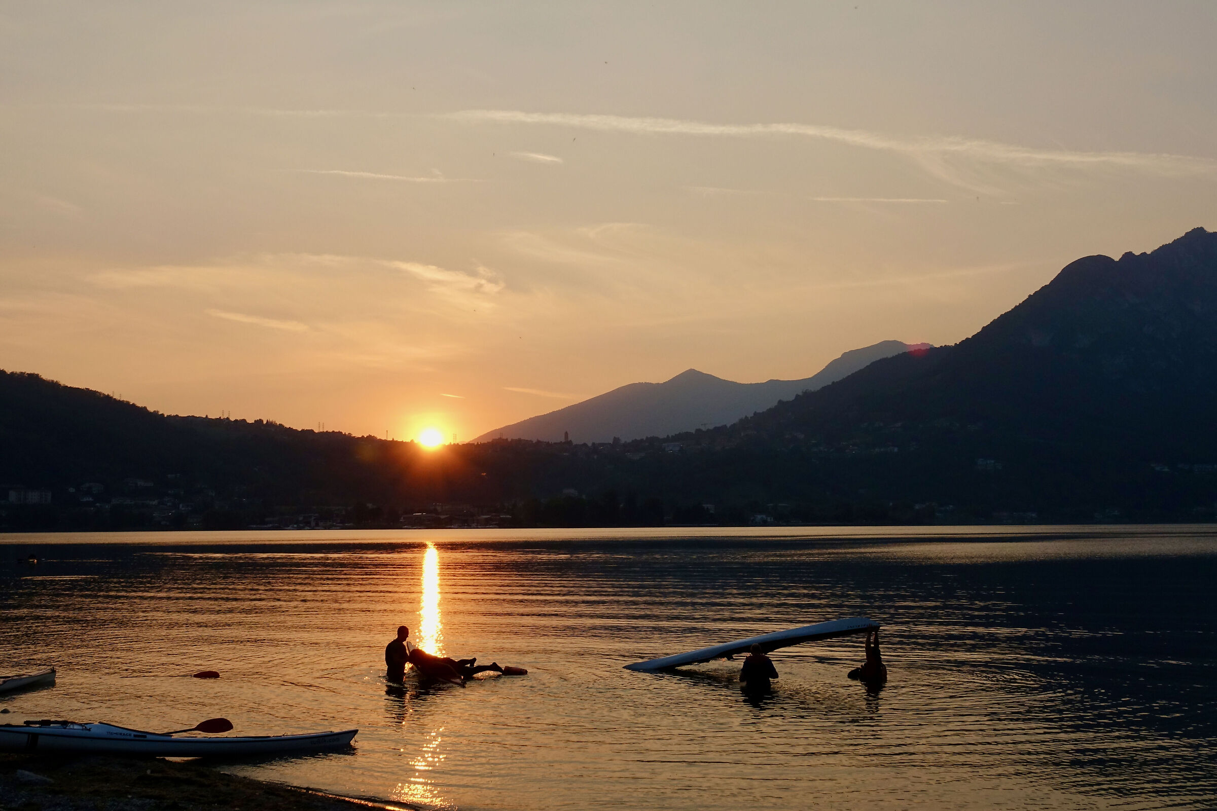 Sunset over Lake Garlate: canoes...