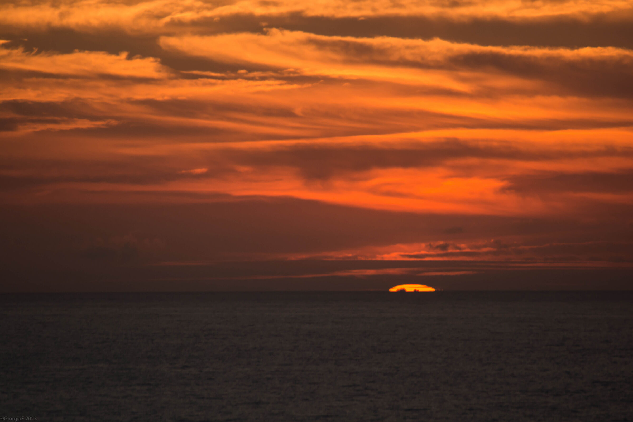 Fiery sunset in Playa del Torimbia...