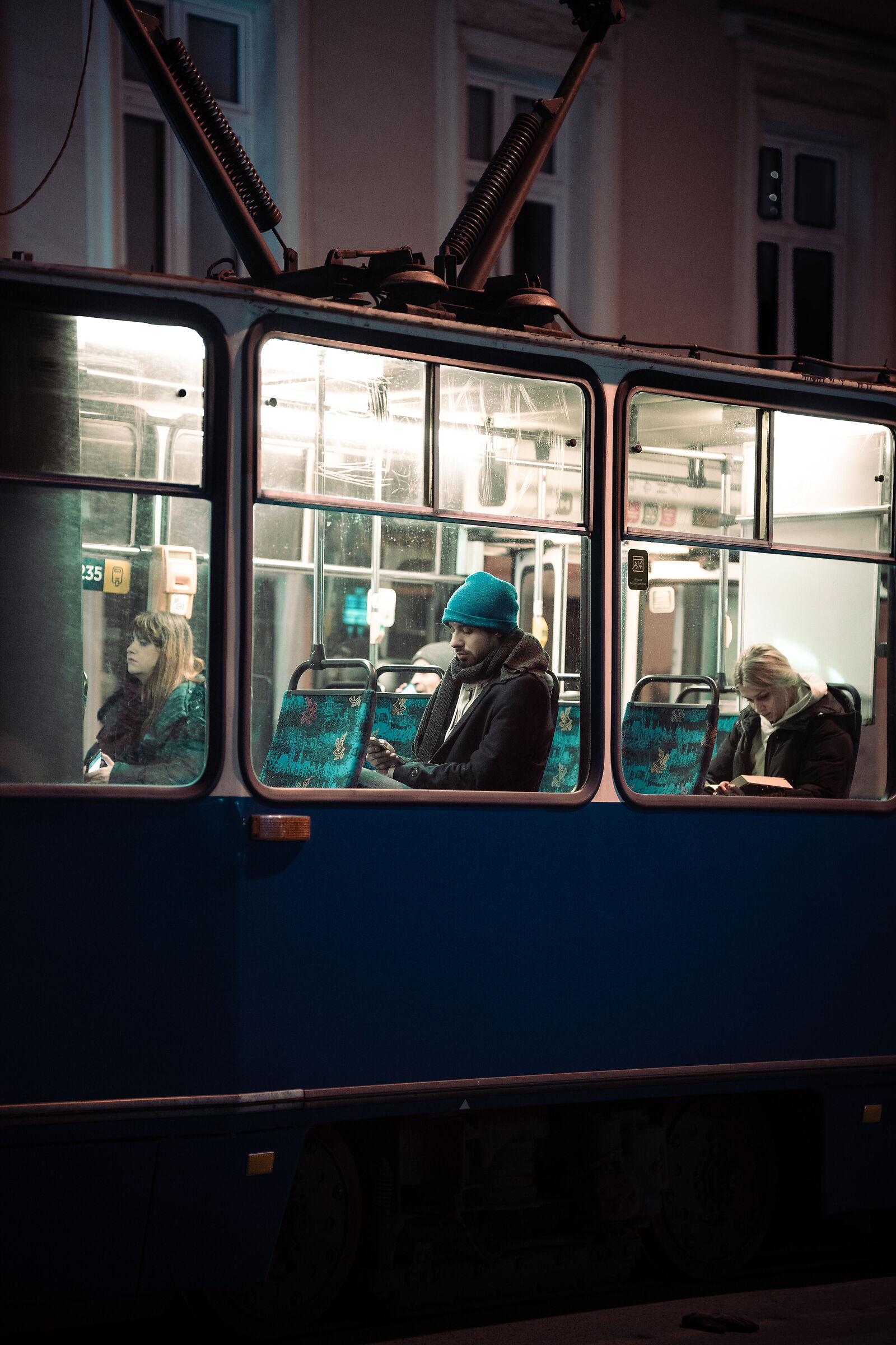 Boy at night on the tram...