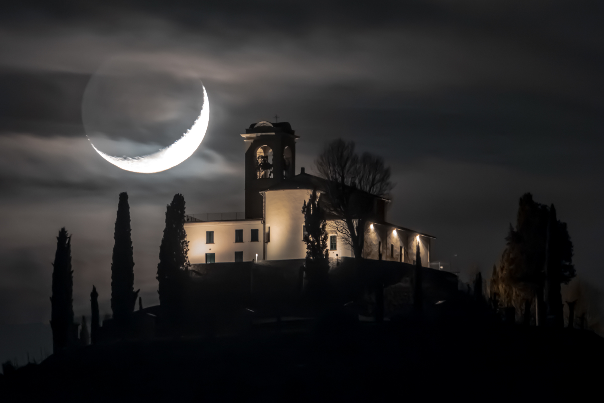 The sunset of the moon on the church ...